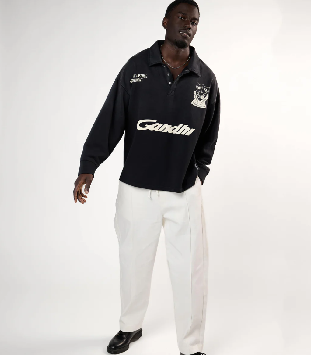 HOPEIUM Football Polo Sweat in washed black with front print, infinity back graphic, and oversized fit.