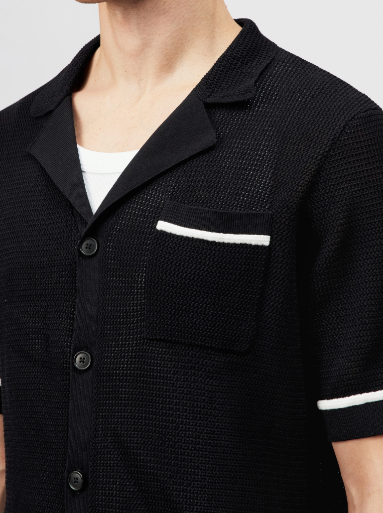 Black FLAVIRO short-sleeve knit shirt by Drykorn in relaxed fit with contrast stripes and 100% cotton for modern casual style.