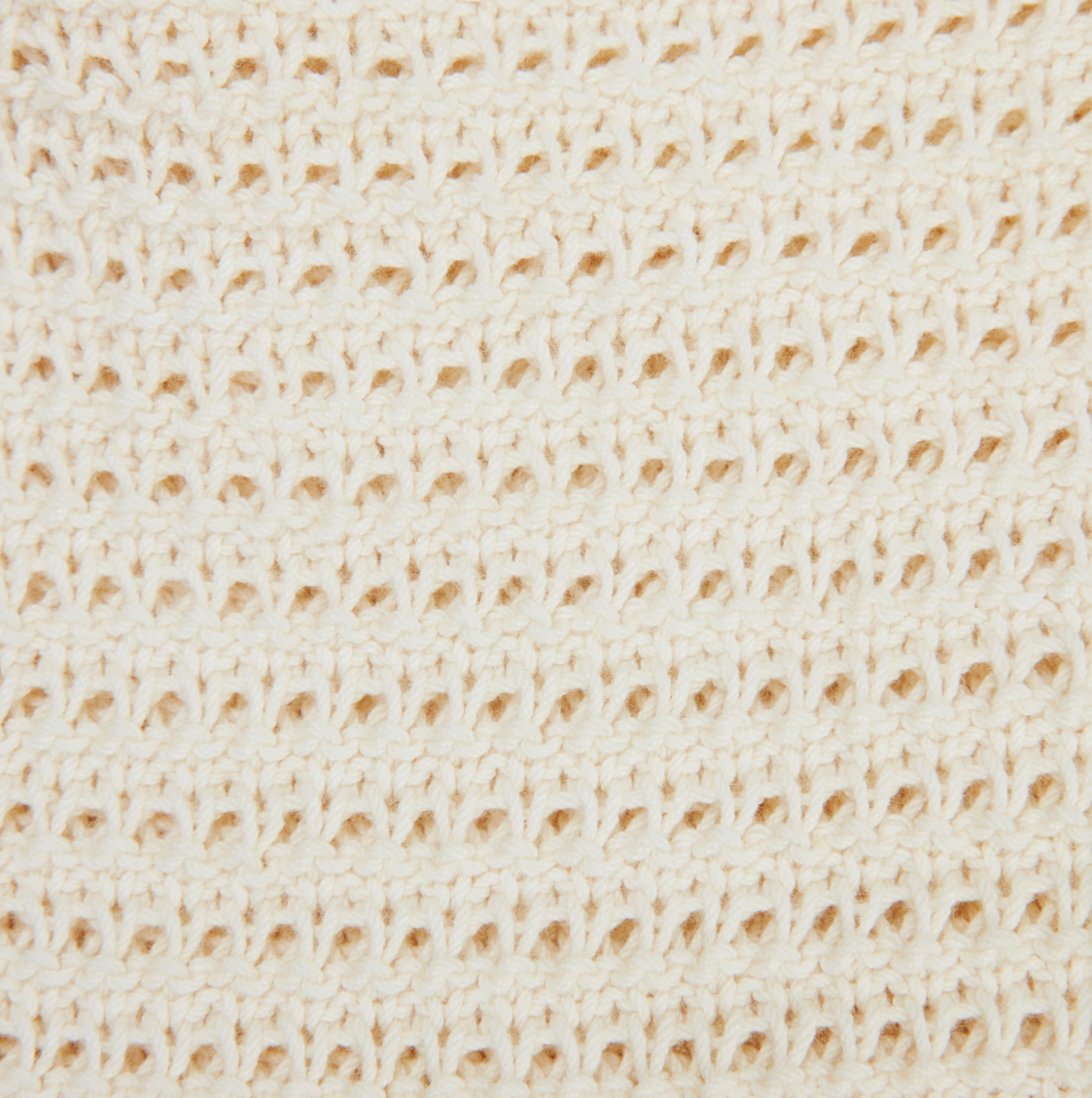 Drykorn AKWY knit top in natural white with halter neck, slim fit, and cropped length in 100% cotton.