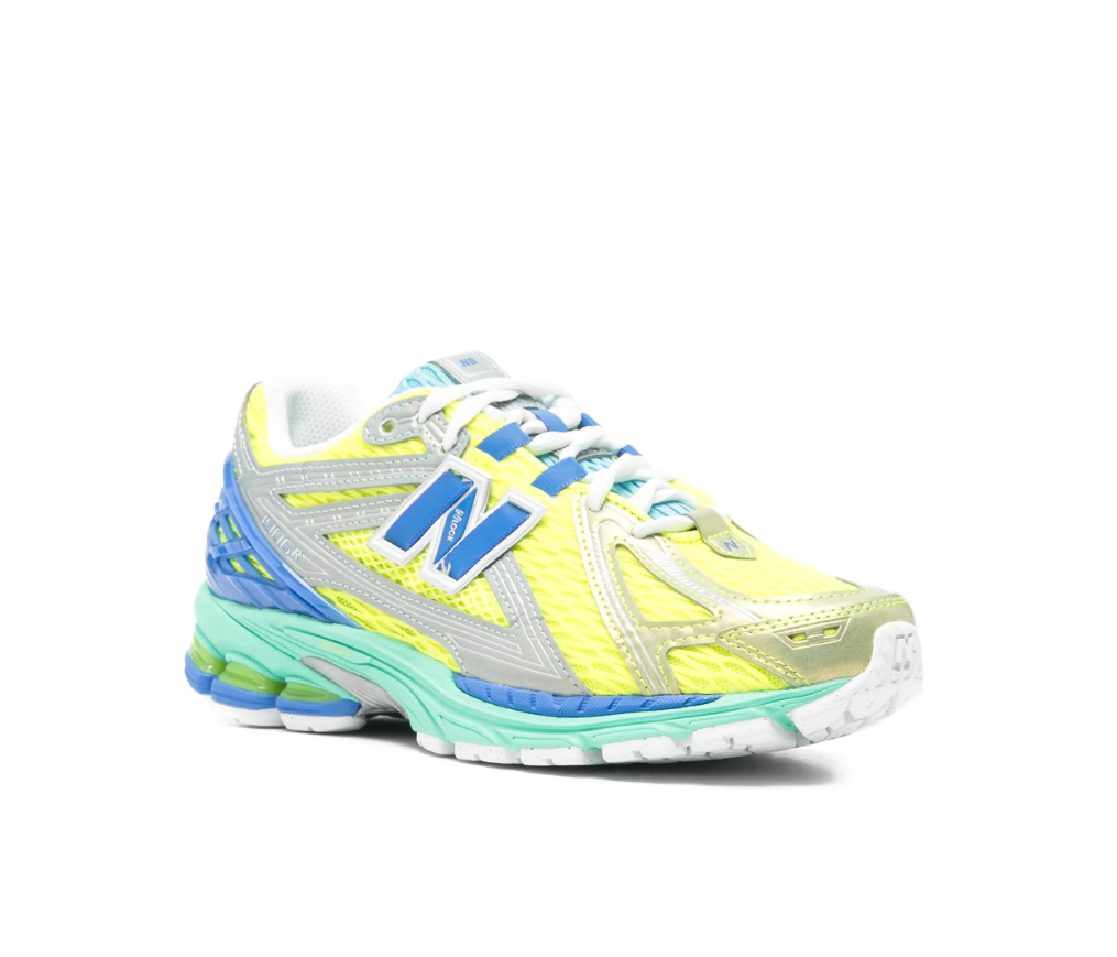 New Balance 1906R sneakers for women in yellow multicolour with mesh upper and metallic panels.