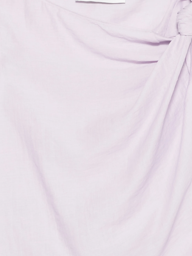 Tela asymmetric top in lilac with twisted shoulder detail, draped silhouette, and linen-viscose fabric.