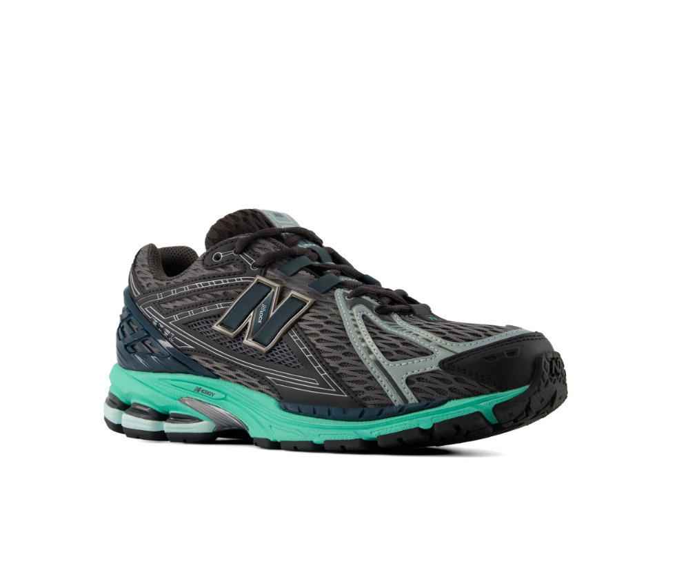 New Balance 1906R sneakers for men in black and teal with mesh upper and cushioned sole.