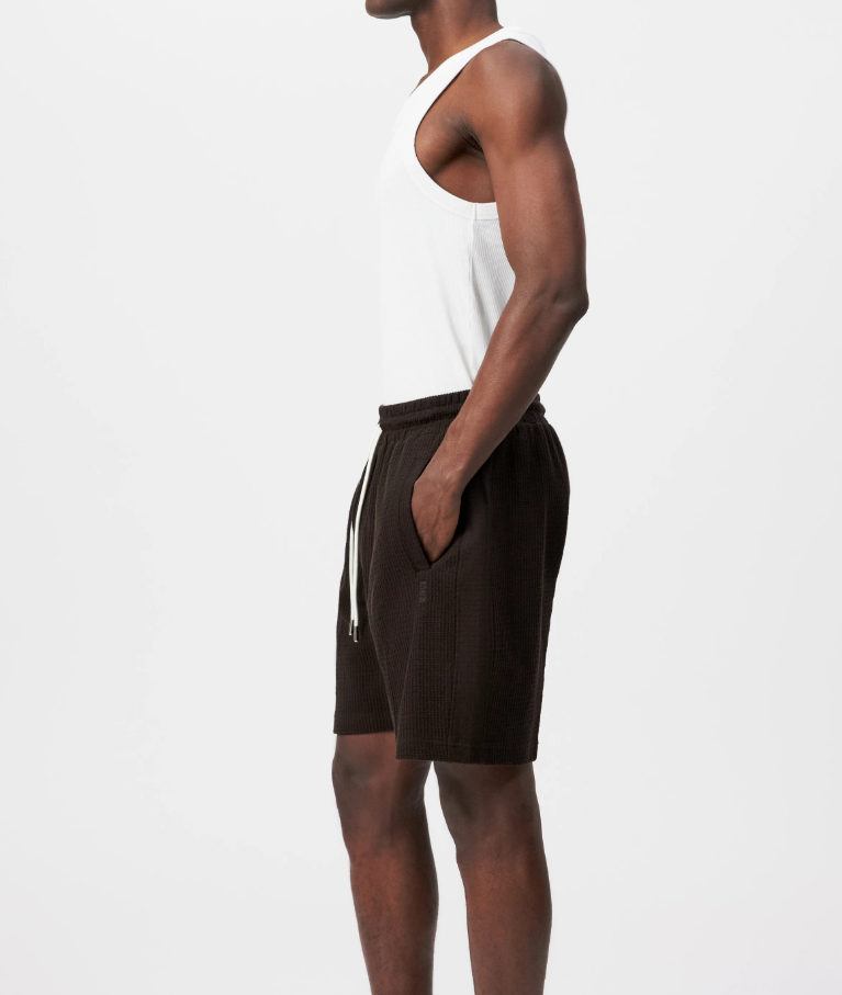Drykorn BRIKKO shorts in brown made from cotton jersey with relaxed fit and minimalist design.