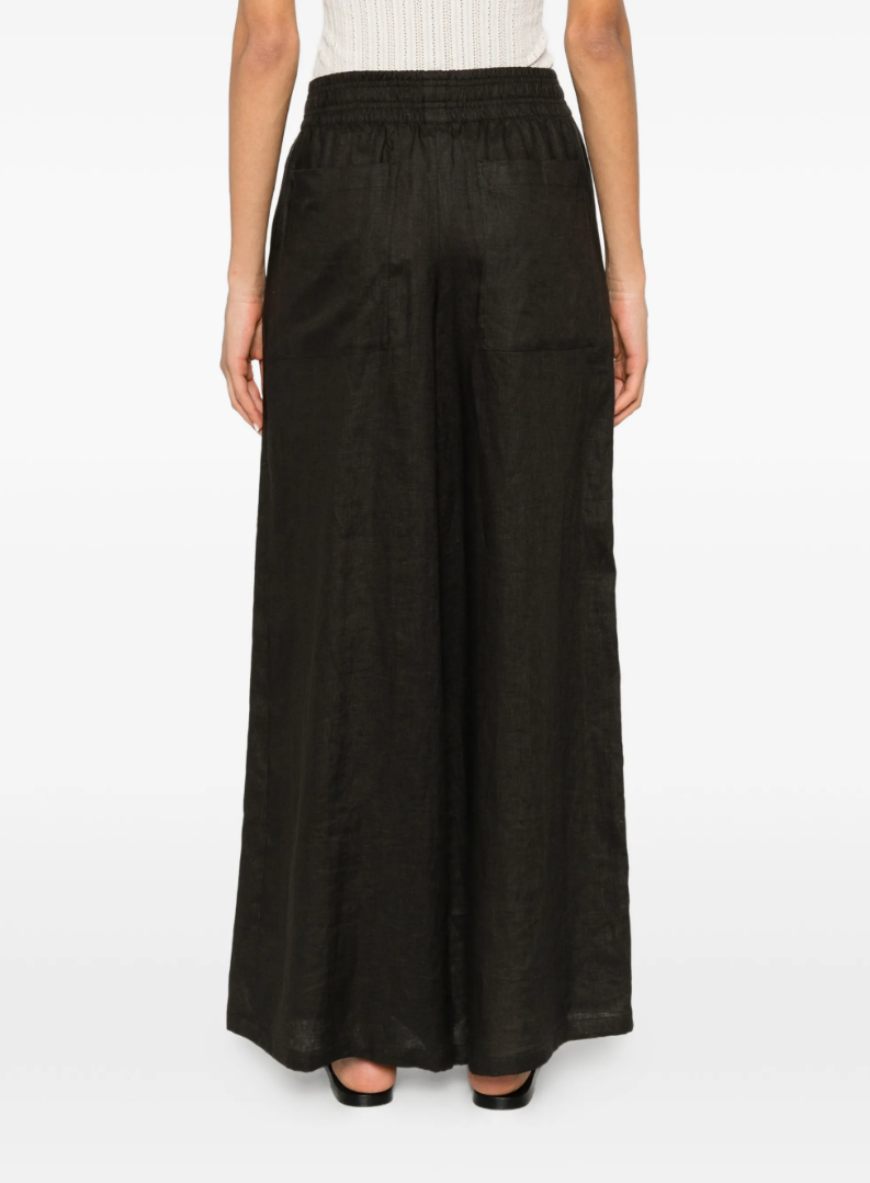 Drykorn CEILING linen trousers in brown with low waist, elastic waistband, and relaxed fit.
