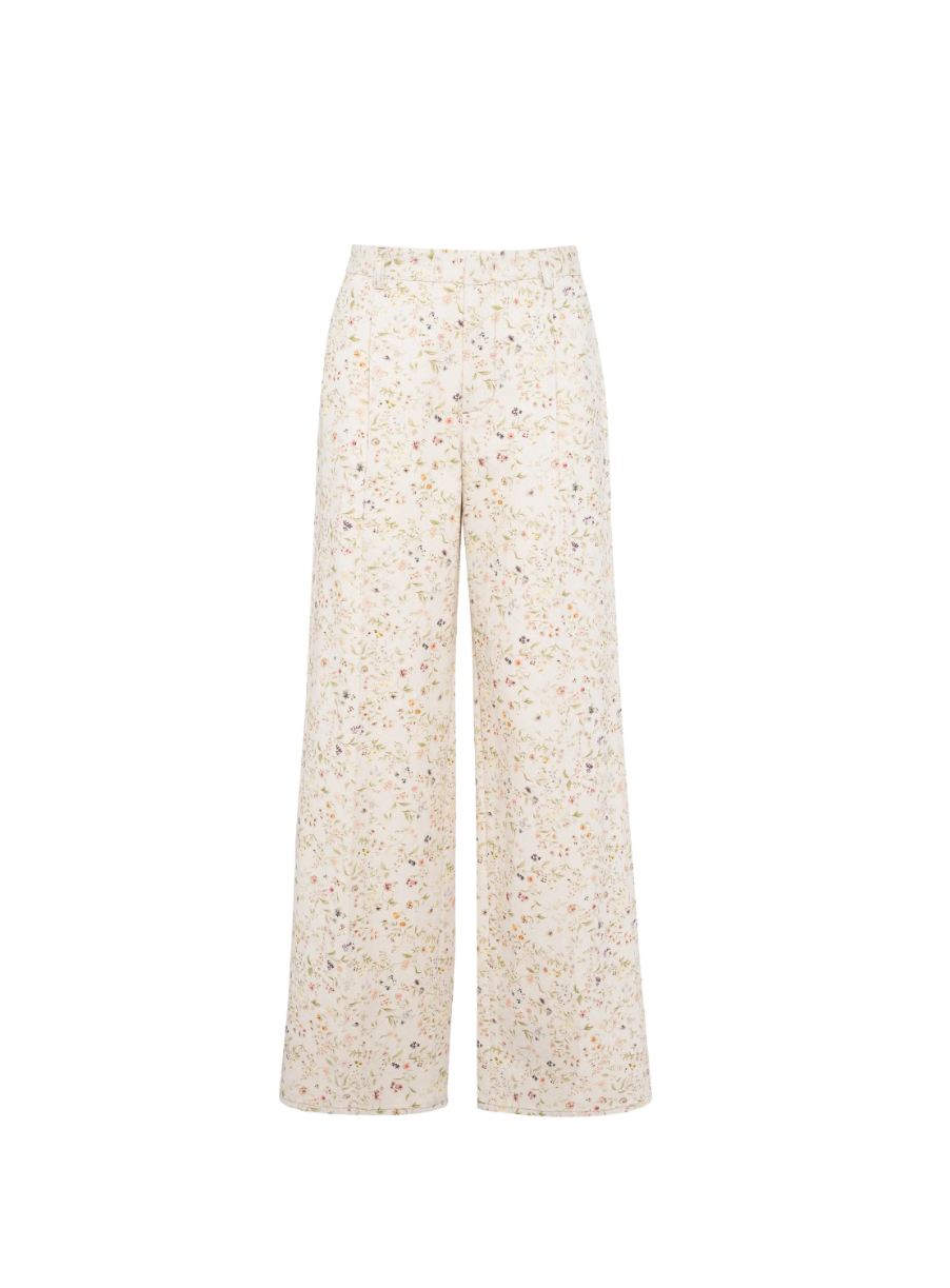 Tela floral print trousers in cream with wide leg, belt, and concealed closure.