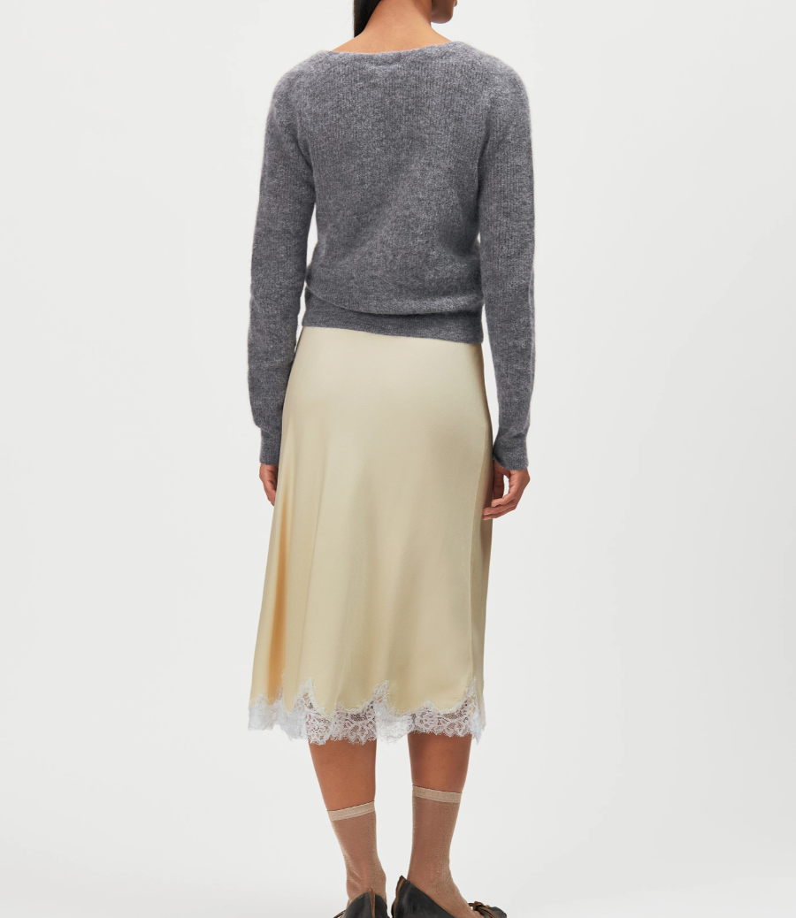 Drykorn LOBAIA Wrap Knit for women in Rainy Day Grey with an asymmetric wrap design, deep V-neck and soft alpaca blend.