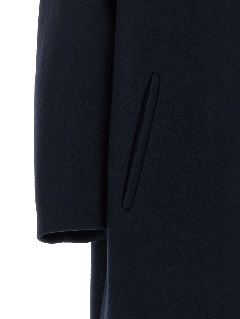 TELA SCOTT Coat in Blue, made in Italy with an oversized cocoon silhouette, asymmetric stand collar, dropped shoulders and button closure.