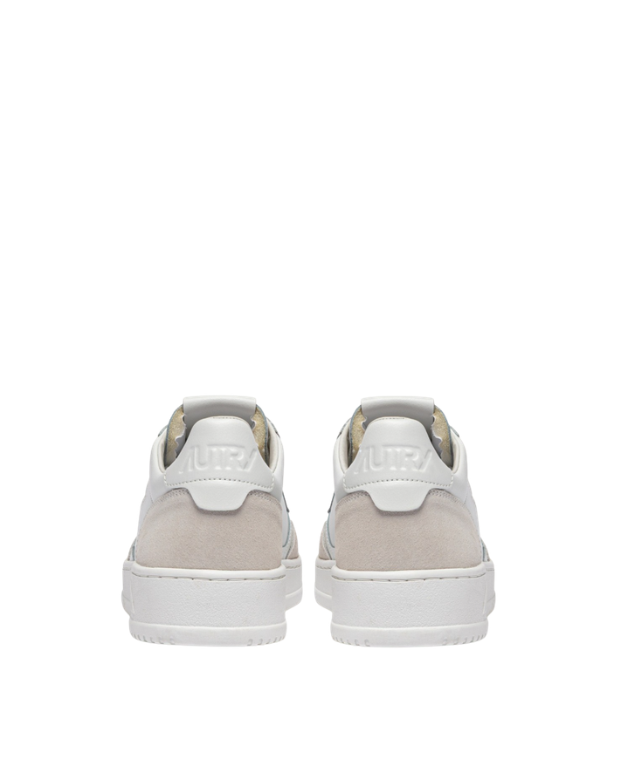 Autry Medalist sneakers in white with suede overlays, perforated toe, and rubber sole.