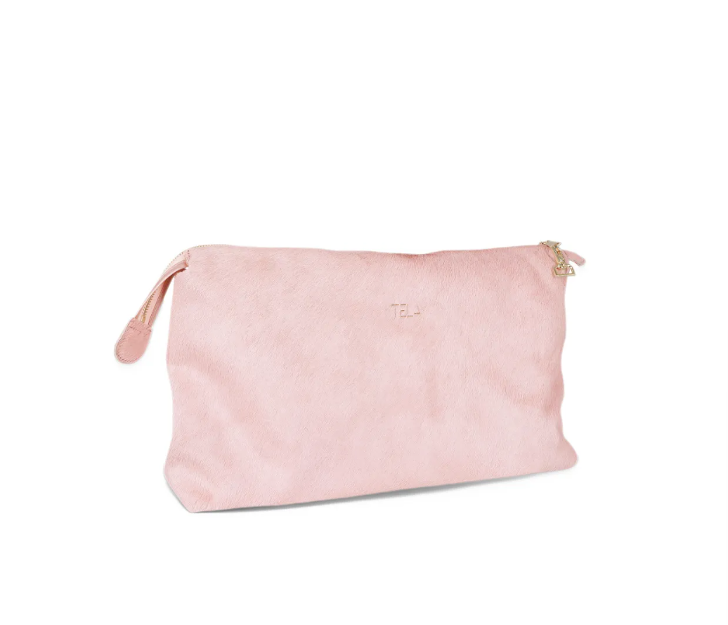 TELA KAORI Clutch Bag in Pink, crafted from 100% goatskin with a luxurious hair-on finish, gold-tone hardware and zip closure.