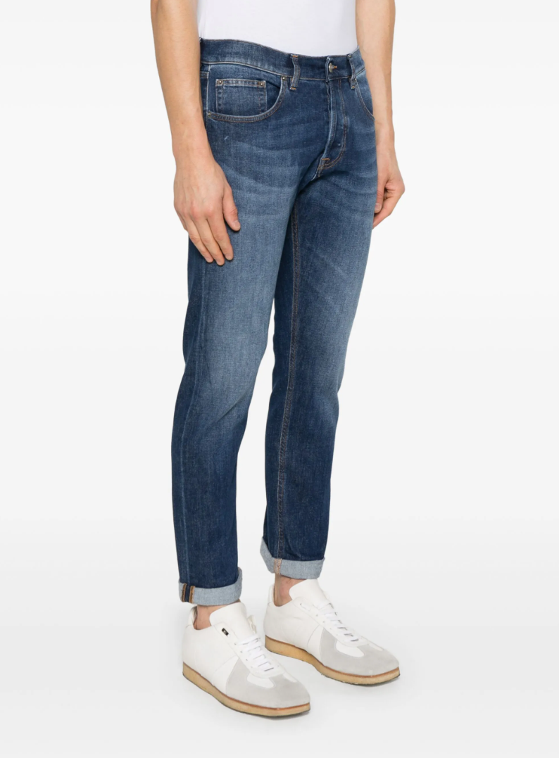 Dondup Icon jeans in indigo blue with button fly, five-pocket design, and logo patch.