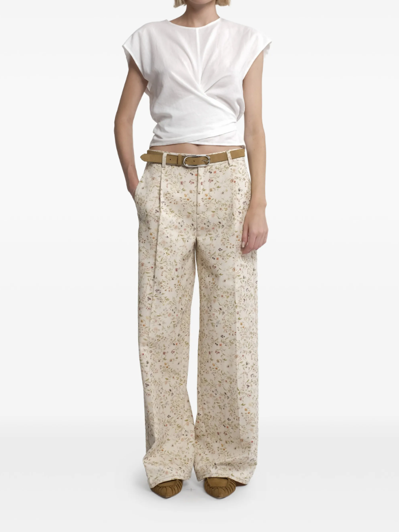 Tela floral print trousers in cream with wide leg, belt, and concealed closure.