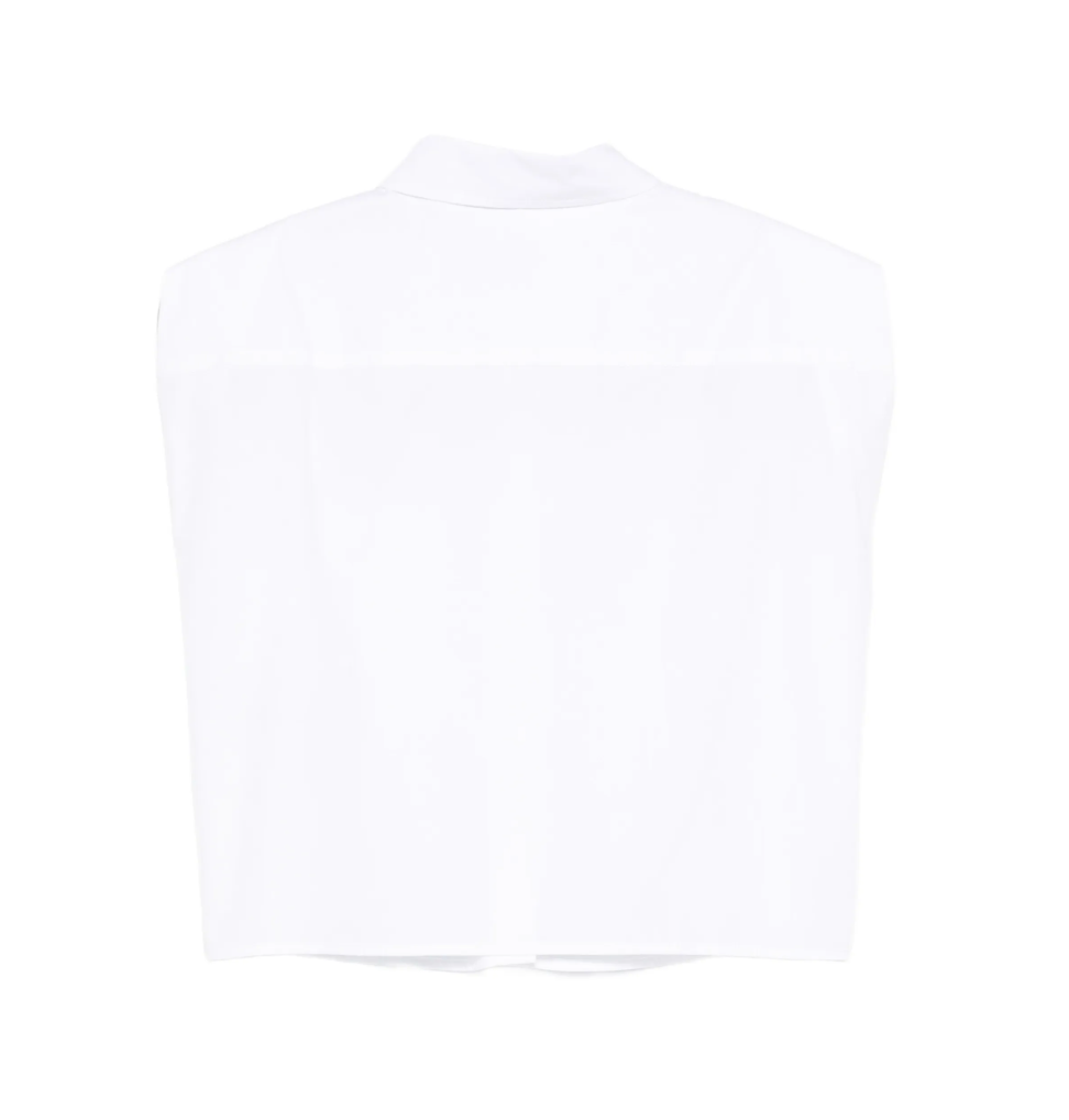 White sleeveless shirt by Tela, made in Italy with button closure and chest pocket for clean, modern styling.
