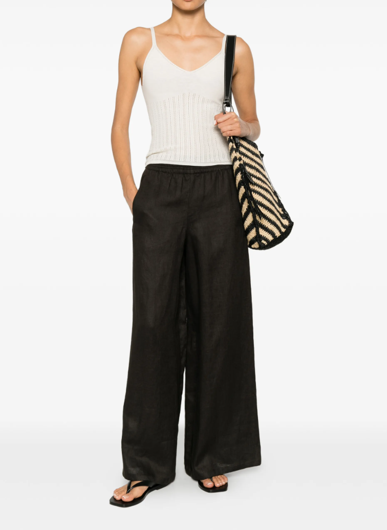 Drykorn CEILING linen trousers in brown with low waist, elastic waistband, and relaxed fit.