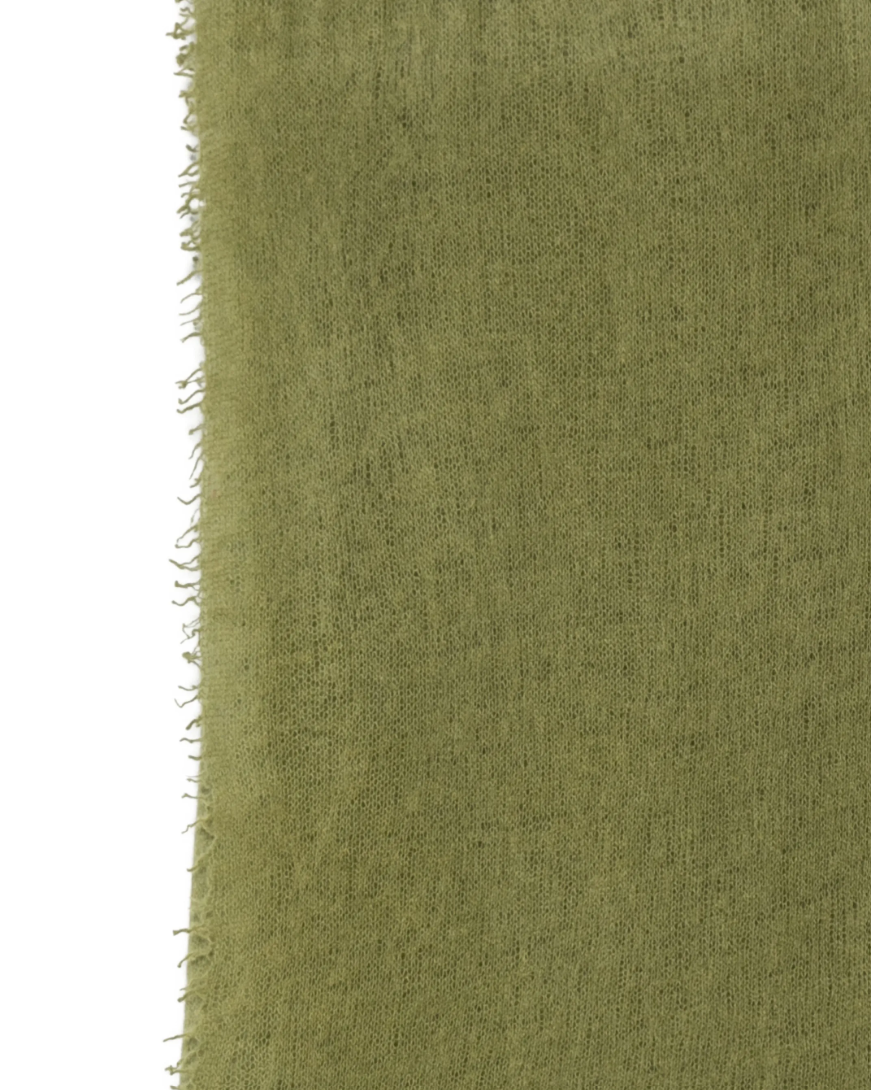 WARM-ME Small NOMAD Scarf in Avocado, crafted from 100% pure cashmere with a lightweight, semi-sheer fine knit and delicate fringed edges.