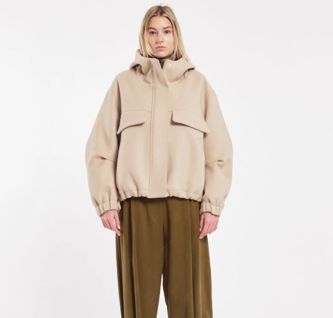 TELA Oversized Hooded Jacket in Beige, made in Italy from a virgin wool blend with flap pockets, zip-and-snap closure and adjustable hem.