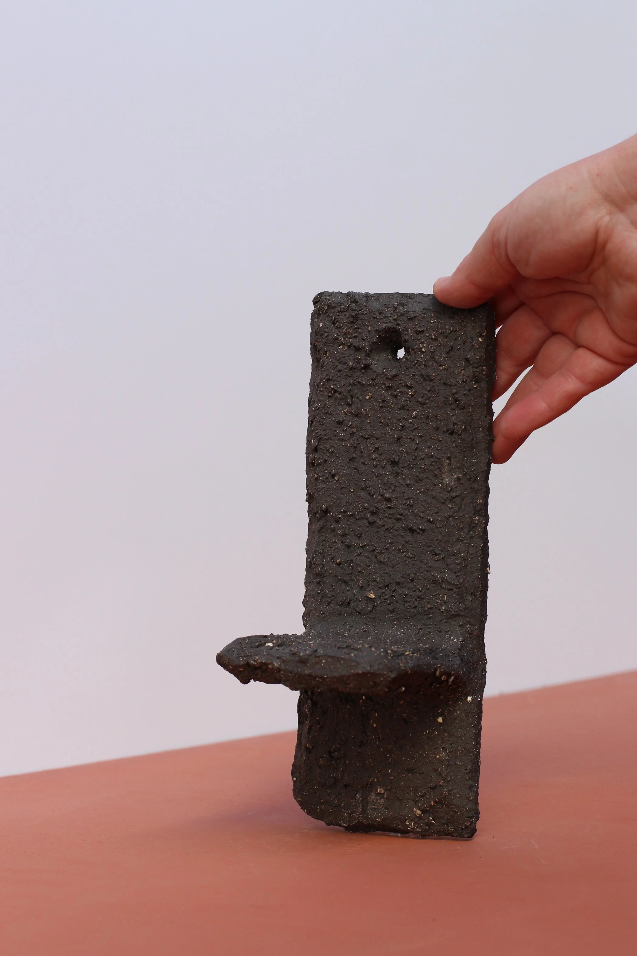 Large textured matt black shelf