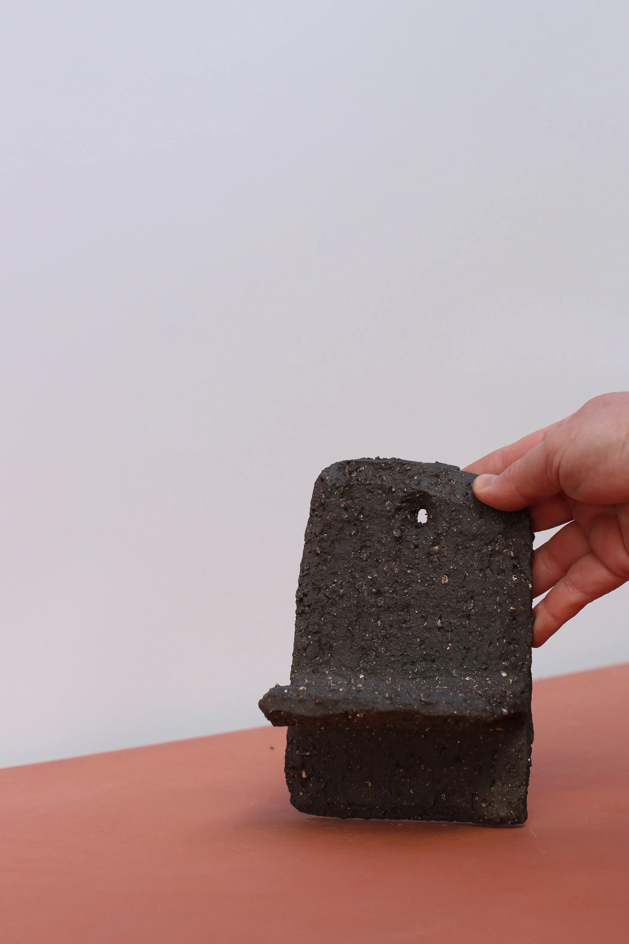 Small textured matt black