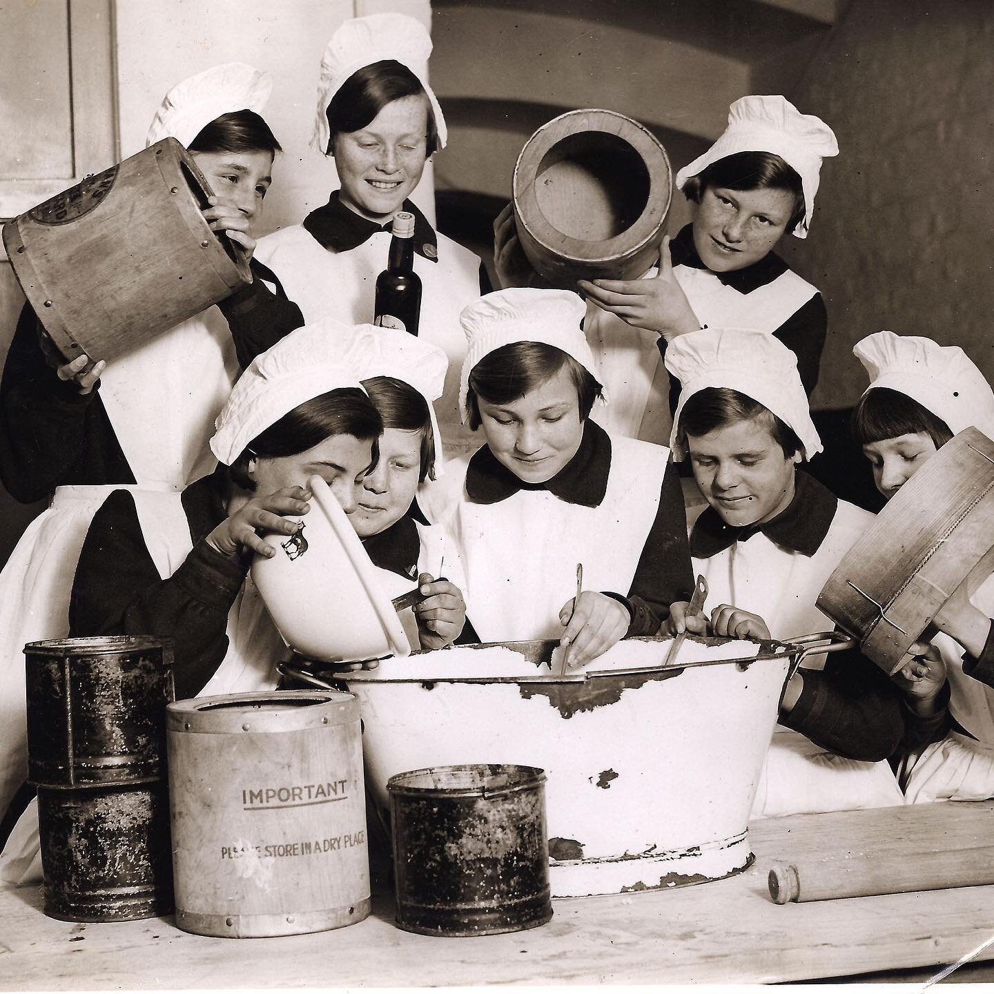 Foundlings pretend to prepare a meal for the camera, circa 1930