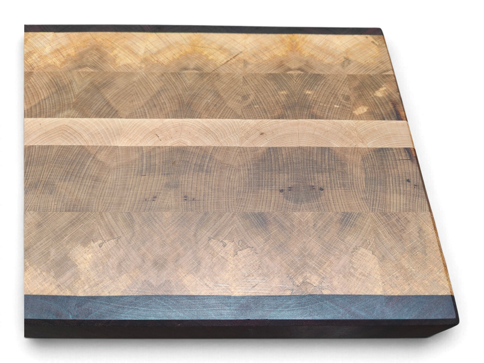 Reclaimed mahogany edge strips on an Irish end grain board