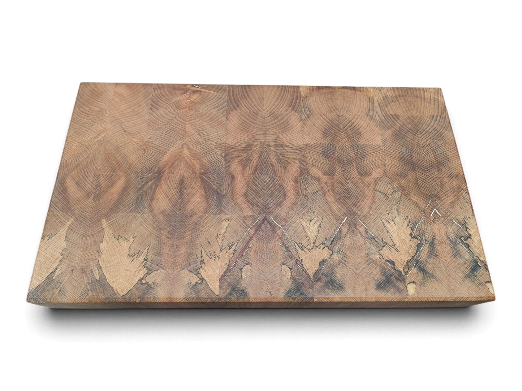 Flame figure giving way to spalt lines across an end grain board
