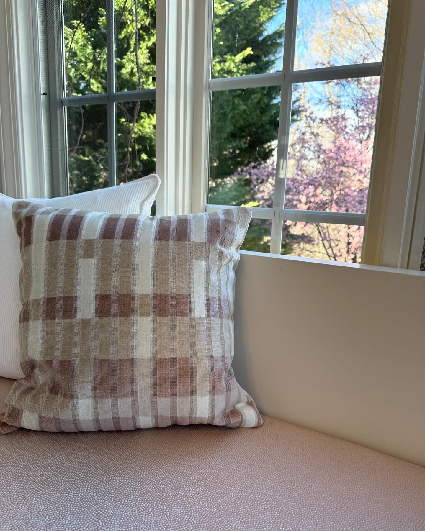 Spring is here!  It&rsquo;s time to curl up on this comfy banquette and watch the flowers bloom!  This custom banquette has stain treated seat cushions for the kids and some glam pillows for mom. #banquette #banquetteseating #pinkpillows #kitchendesi