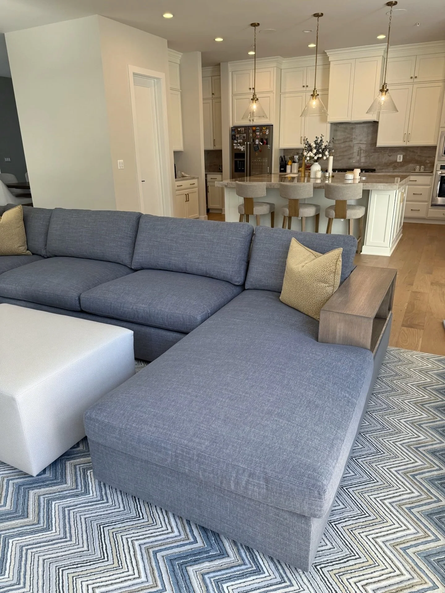 A generously scaled sectional paired with a patterned rug that grounds the space &ndash; soft lines, layered blues, and tailored materials chosen to feel relaxed but not flat.

#interiorstyling #modernliving #layeredinteriors