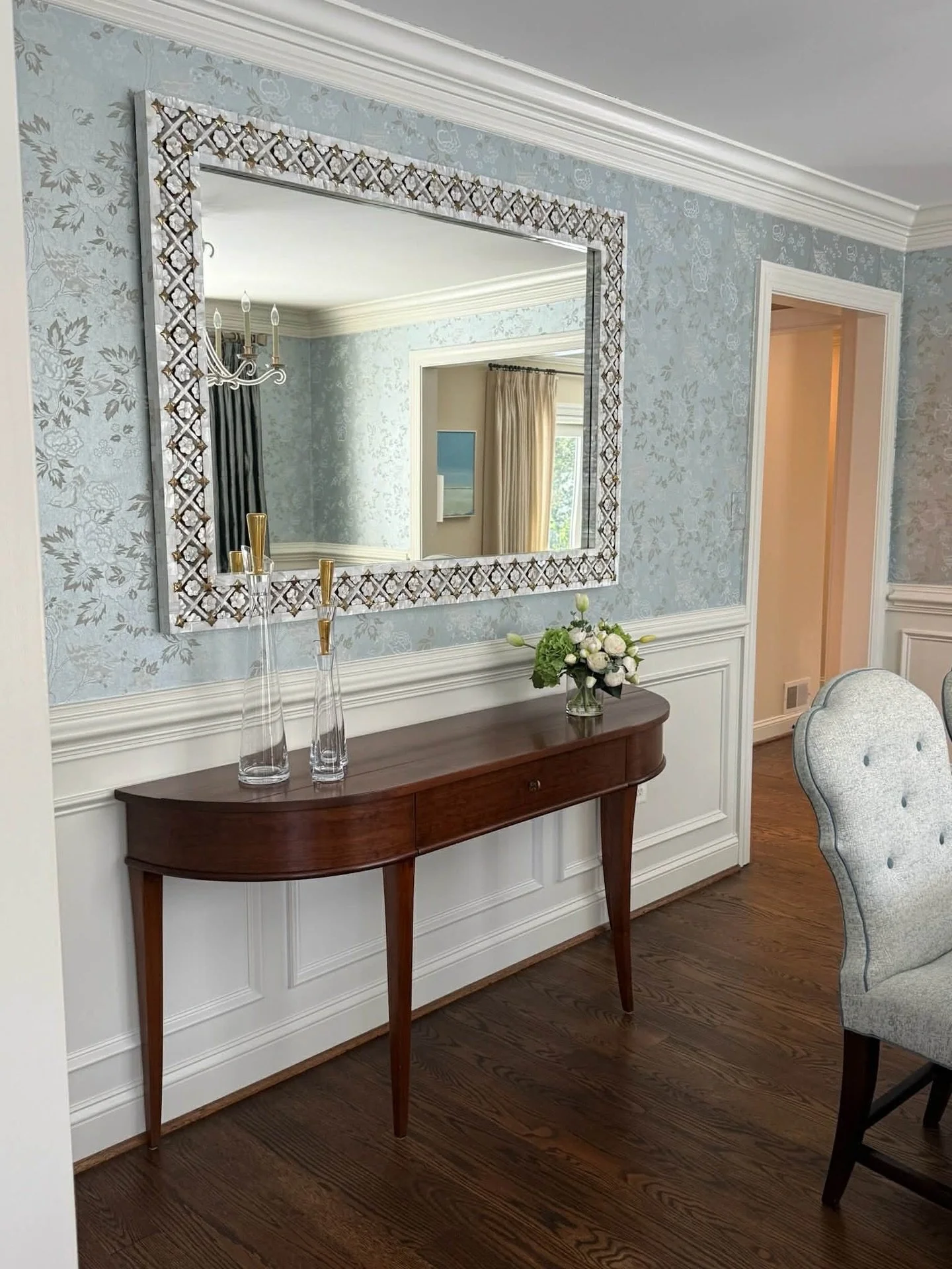 Featuring another space &mdash; the dining room &mdash; from a recently completed whole-house redesign in Fairfax, VA.

A Randolph &amp; Hein mirror visually expands the room, reflecting light, detail, and symmetry while a Niermann Weeks buffet ancho