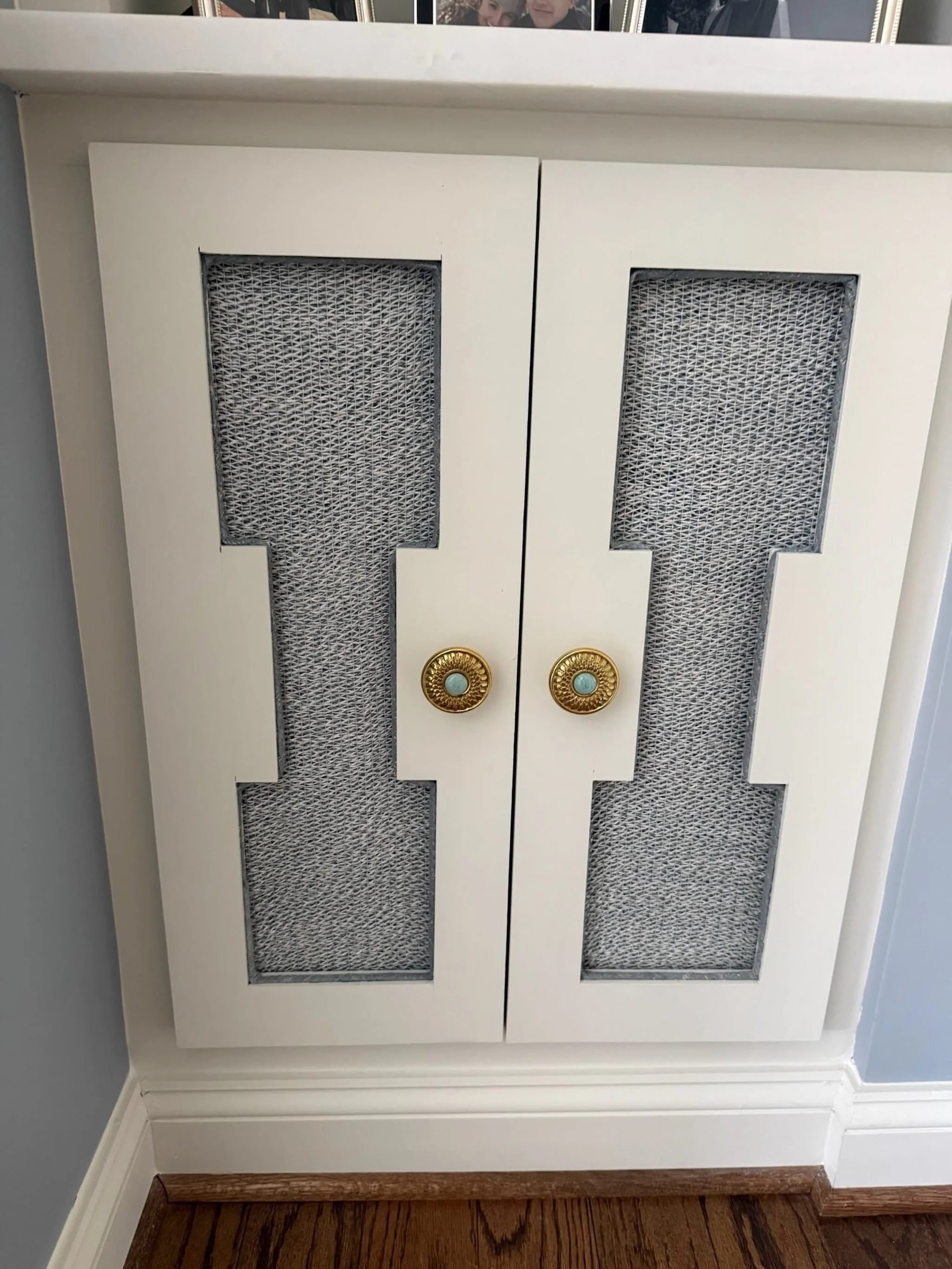 Sometimes a smaller moment ends up making the biggest difference in a space. 

The fabric inlays in these cabinet doors add just enough texture to keep it interesting, while the millwork gives it a really clean, tailored look. 

Layer in the hardware