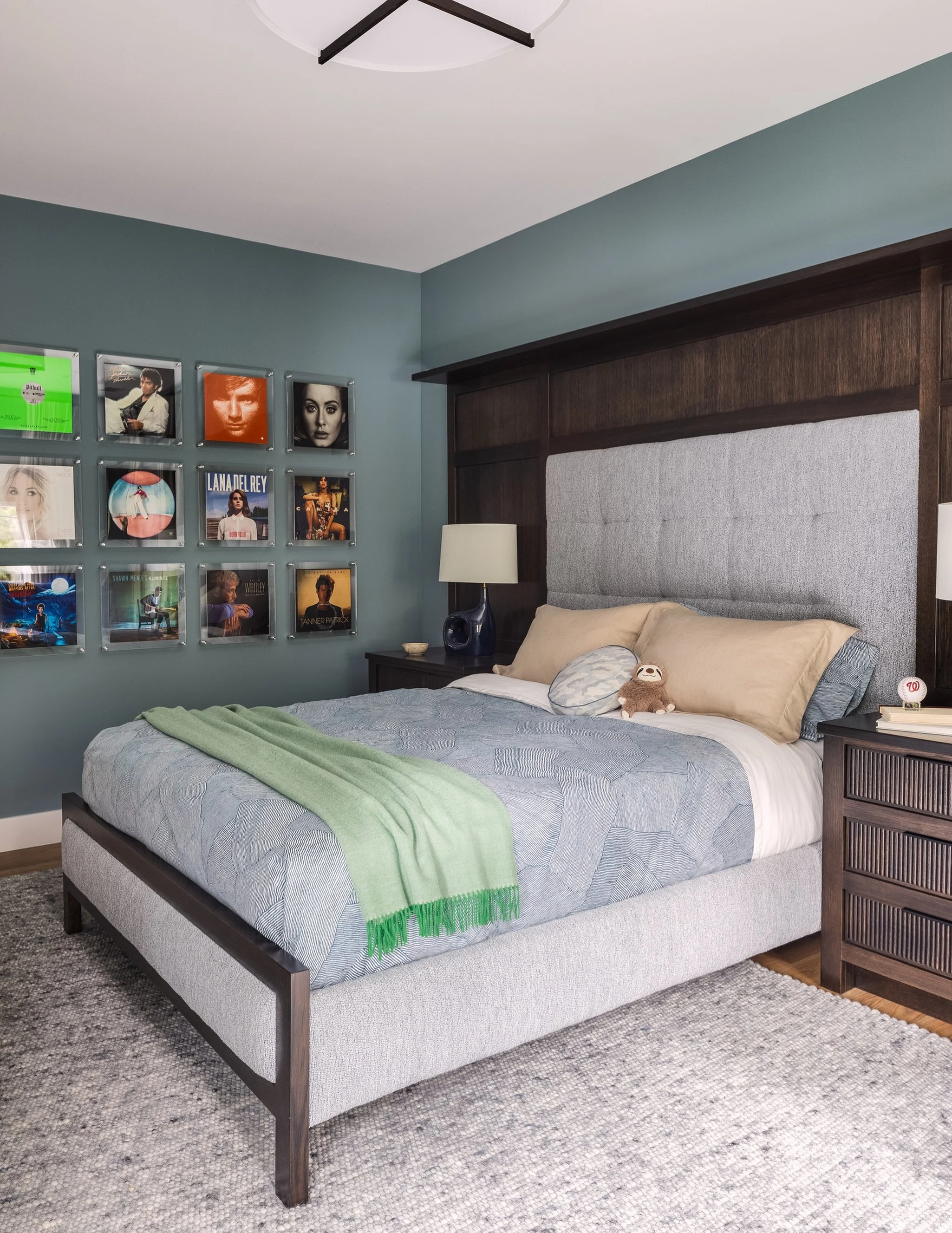 One of my favorite parts of designing bedrooms for older kids and teens is finding ways to make the space feel personal without turning it into a theme room.

In this bedroom, we incorporated some favorite album artwork into the gallery wall and pair