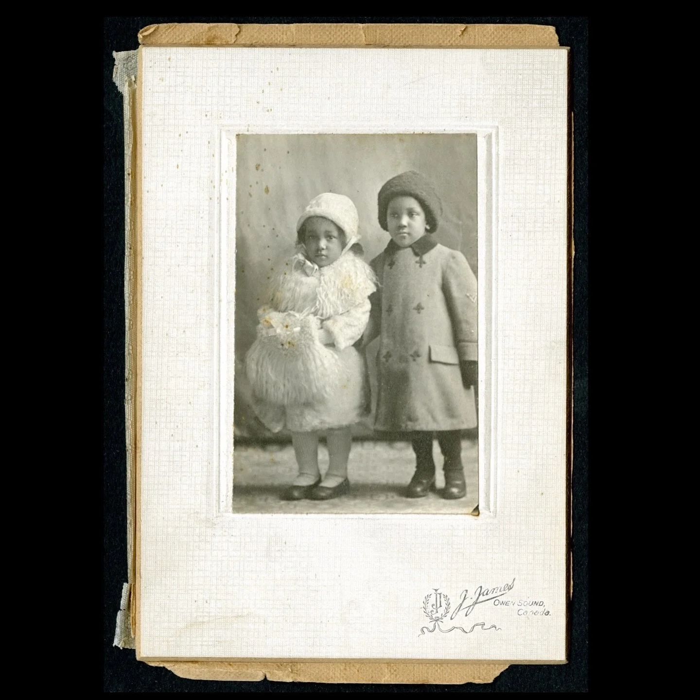 c 1920, studio portrait of two young children in winter coats and accessories. 
 
{*back to my quiet afternoons and random research &gt; 📂 &gt; these sweet angels remind me of my niece and nephew in their Sunday best 🥹 &hellip;I hope they grew old 