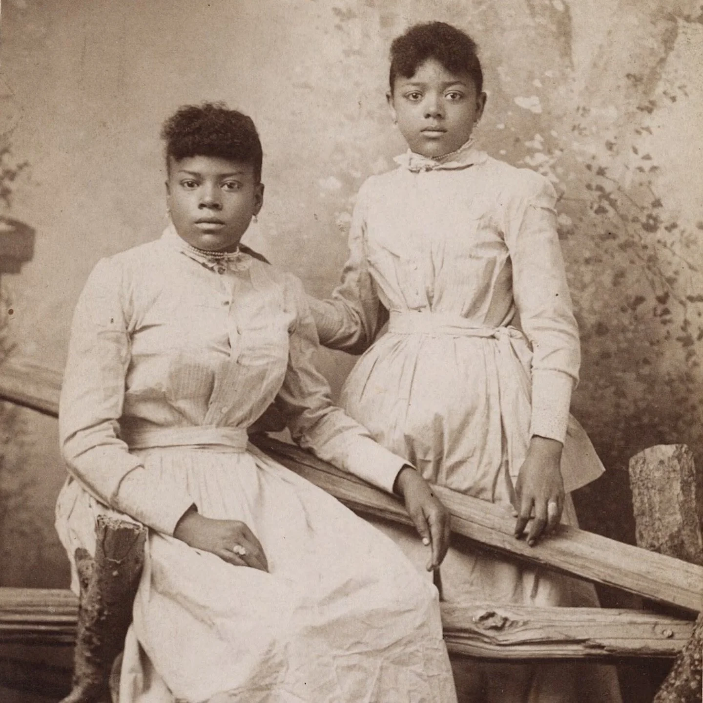 c 1875, decorated studio portrait of two young women, Greenville, Mississippi 🌸 
 
{*the light material of their dresses and outdoorsy backdrop is channeling spring and that&rsquo;s the energy I&rsquo;m seeking rn 🌞} 
 
🗂️ &mdash;Yale University L
