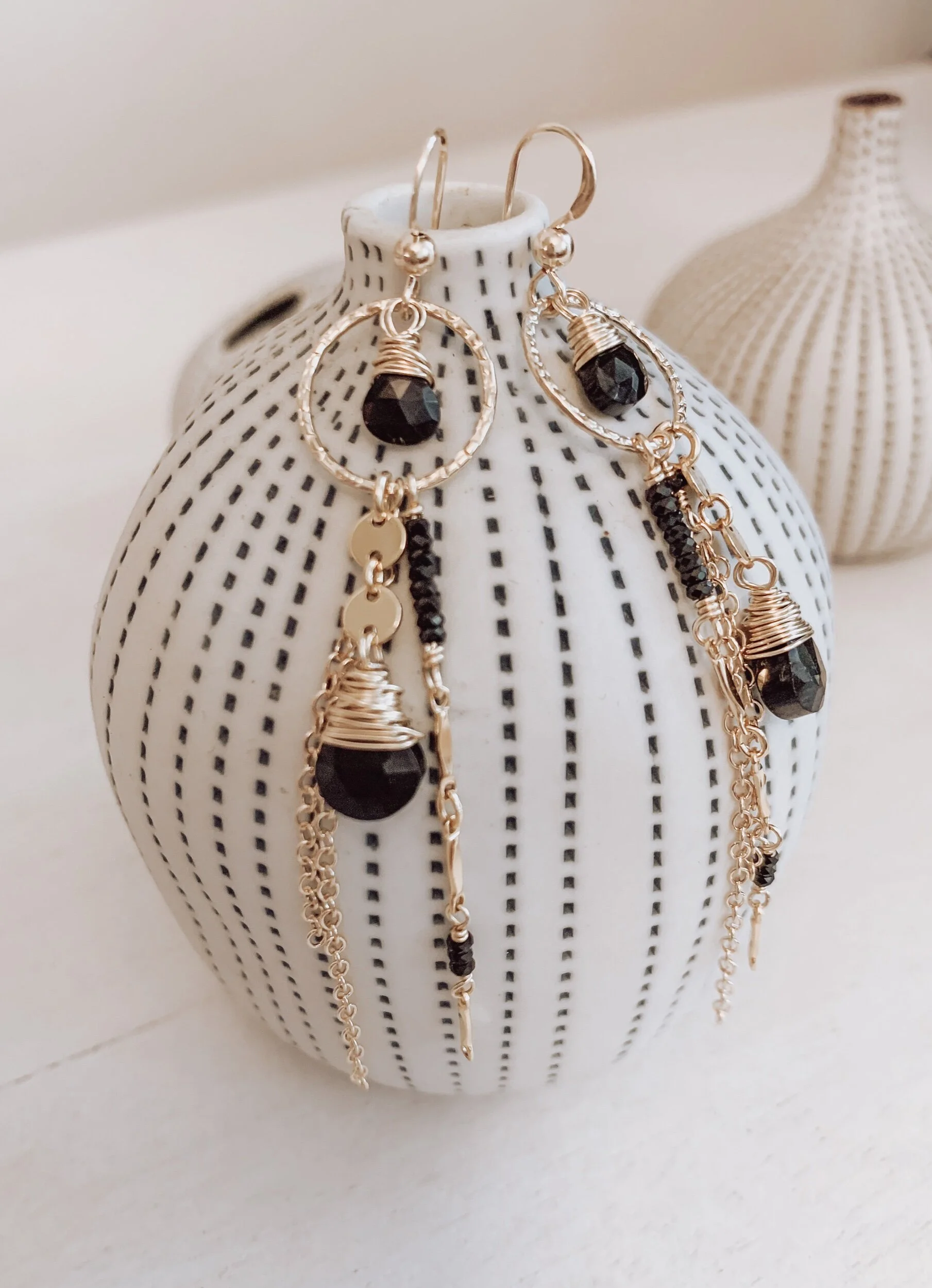 gold and black gemstone earrings