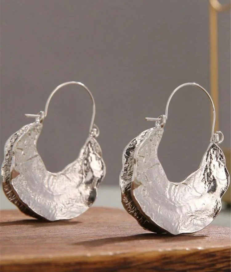 Irregular shaped silver Fulani earrings 1.1 - Style Me African.jpeg