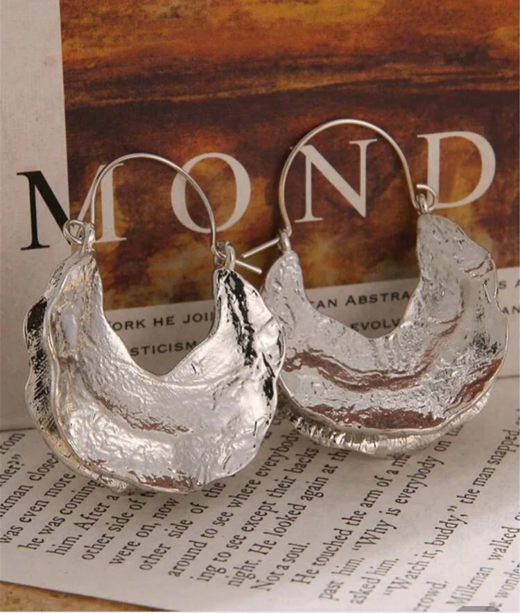 Irregular shaped silver Fulani earrings 1.2 - Style Me African.jpeg