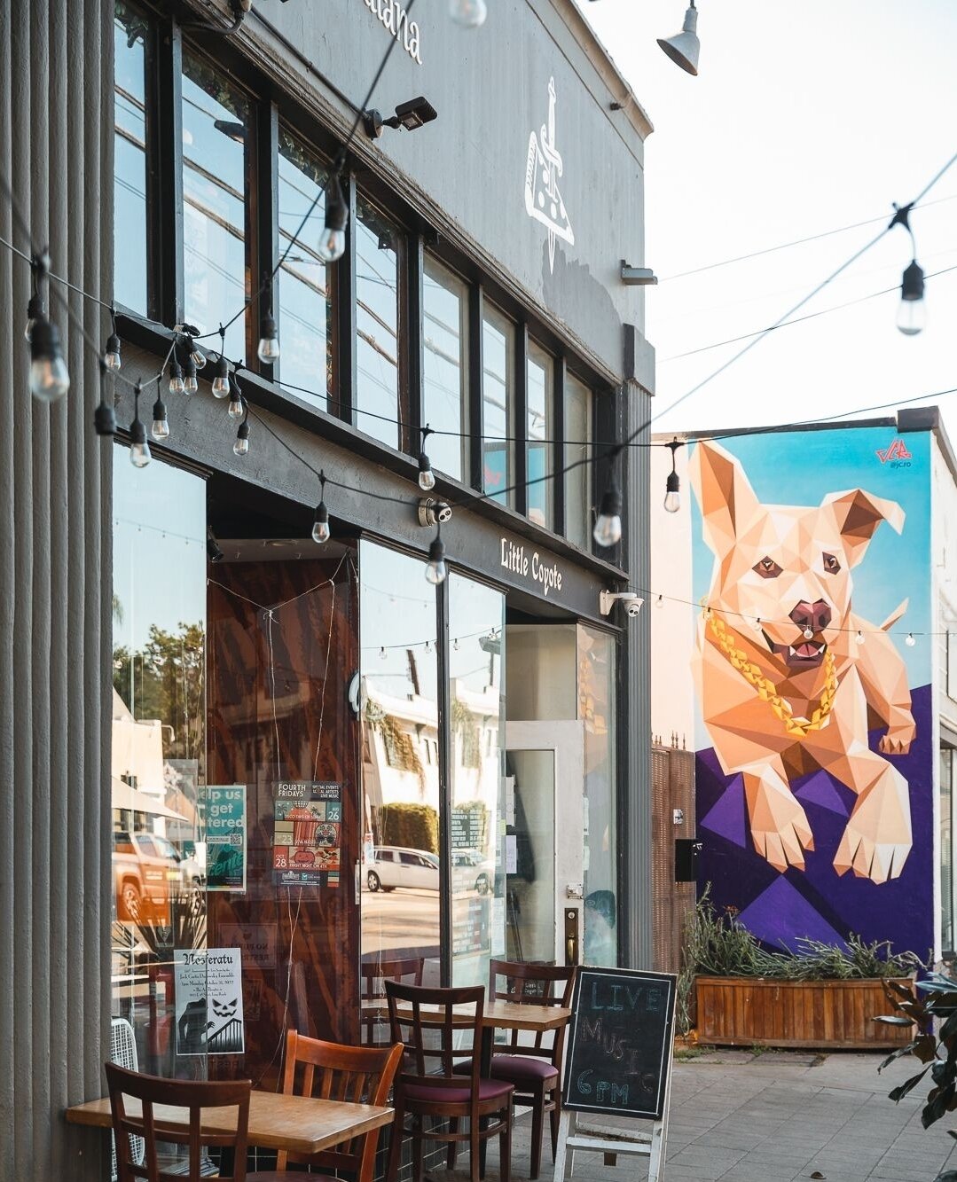 Have you spotted this mural on #4thstreetlb next to @littlecoyotelbc? 🎨 SWIPE to see the artist and muse. 😉 🐶⁠
⁠
Come find this mural by @jc.ro ⁠before it's gone! In just a couple of months it will be replaced by a new art piece from another artis