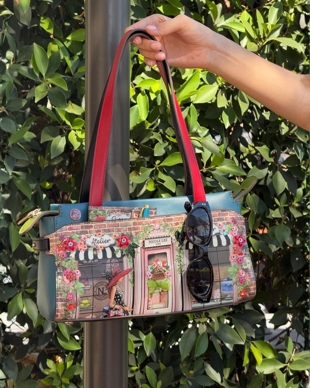 Fall in love with Parisian charm with the Sugar Day Shoulder Bag, featuring a delightful boutique-inspired print filled with colorful florals, charming caf&eacute; details, and fashionable accents. 

Find the Sugar Day Shoulder Bag in link in bio.

#