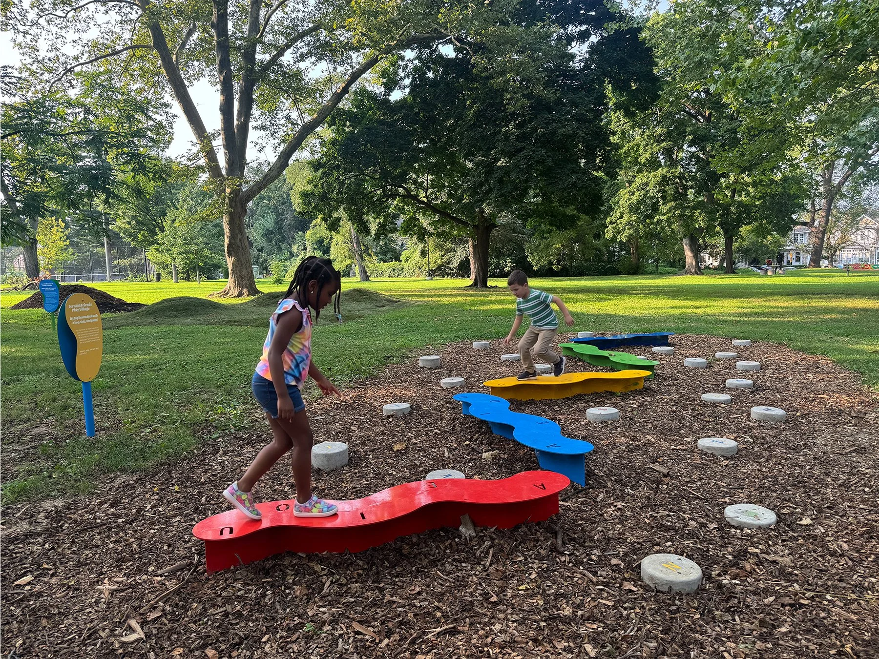 Kids playing spelling lava game in park