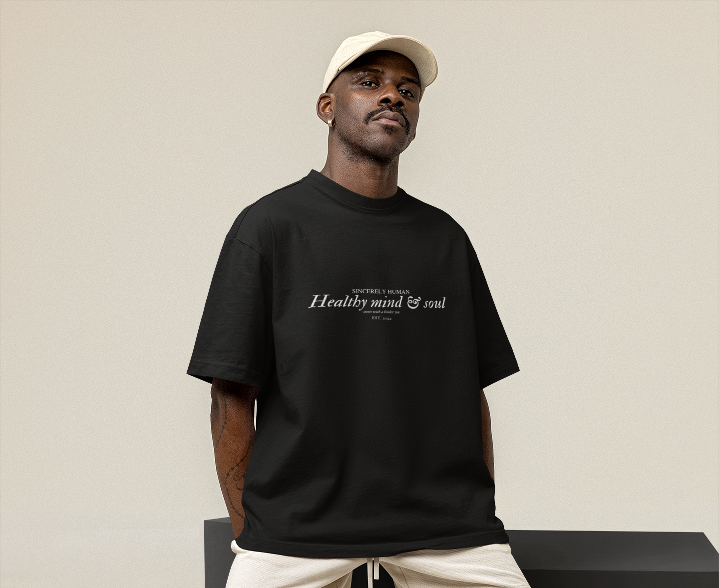 oversized-tee-mockup-featuring-a-man-sitting-on-an-ornamental-cube-m26161 (1)F.png
