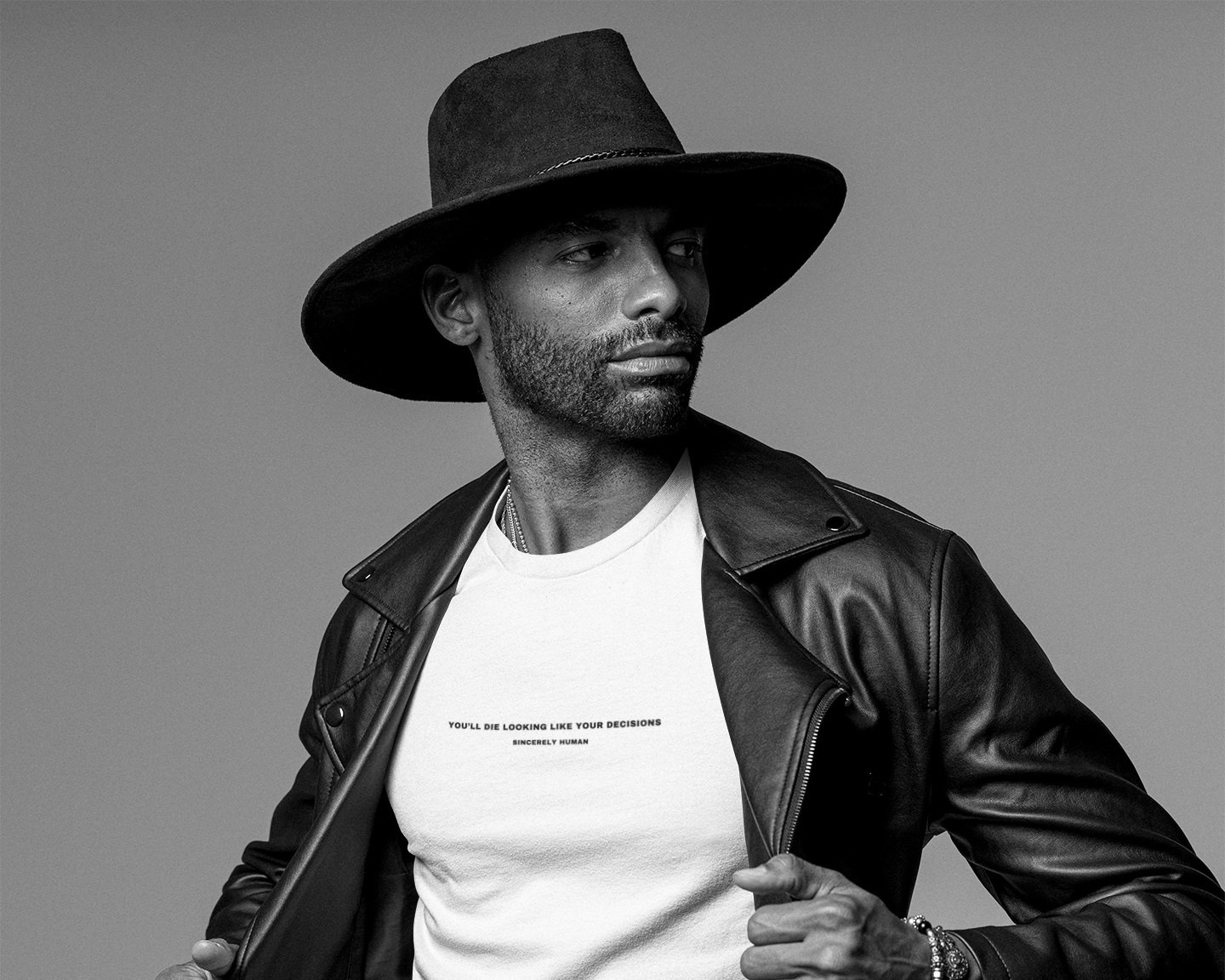 bella-canvas-tee-mockup-of-a-man-looking-sideways-while-wearing-a-black-outfit-m26423.jpg