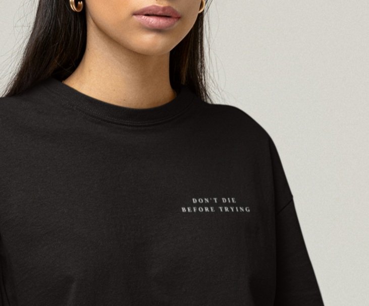 tee-mockup-of-a-woman-sitting-on-a-cube-at-a-studio-m26156+%2816%29J.jpg