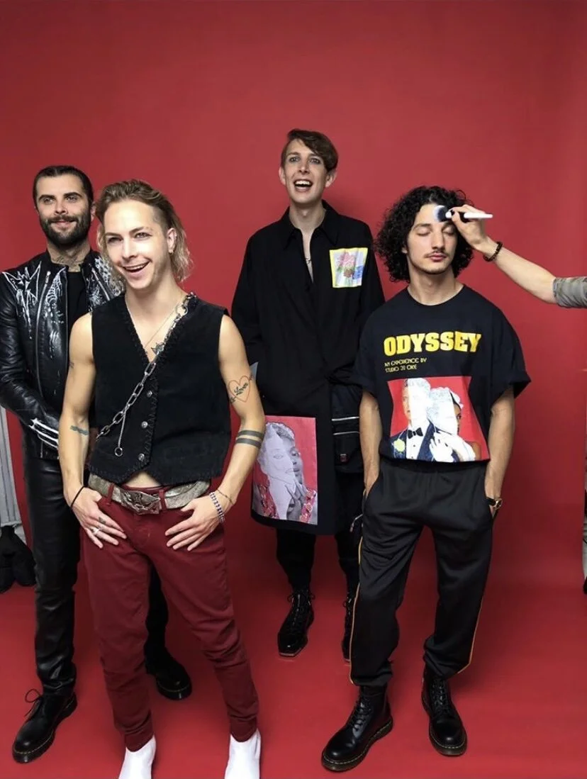 The Hunnaband wearing Odyssey T-shirt &amp; Black Statement Long Coat