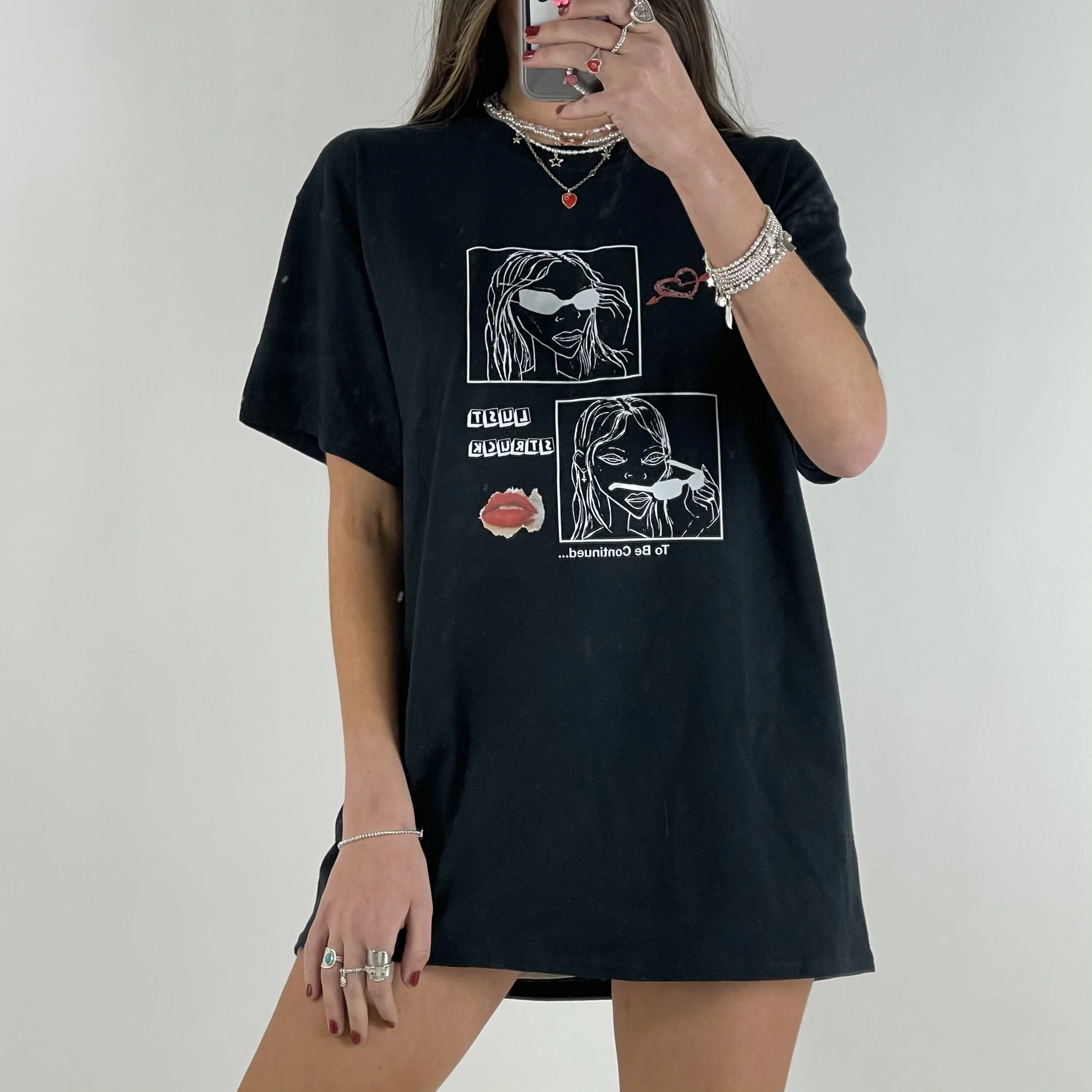 Black T Shirt - Lust struck Relaxed fit, using T-Shirt surface area like an Art canvas, combining bold text and signature Unaji illustrations. 