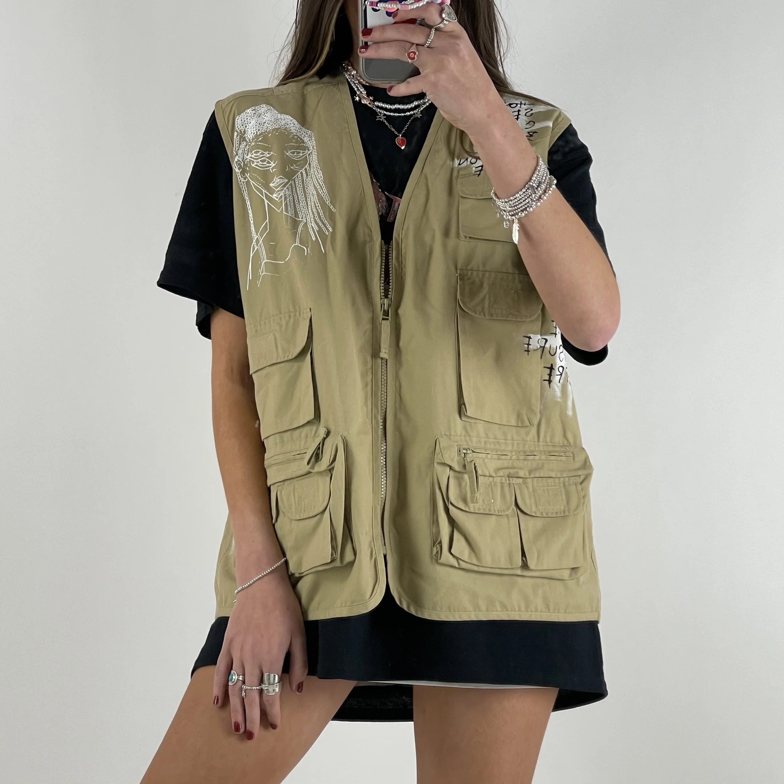 Beige Tactical Vest - Kate Moss & Pete Docerty Up-cycled vest using the surface area as canvas. Illustration of supermodel Kate Moss & musician Pete Doherty