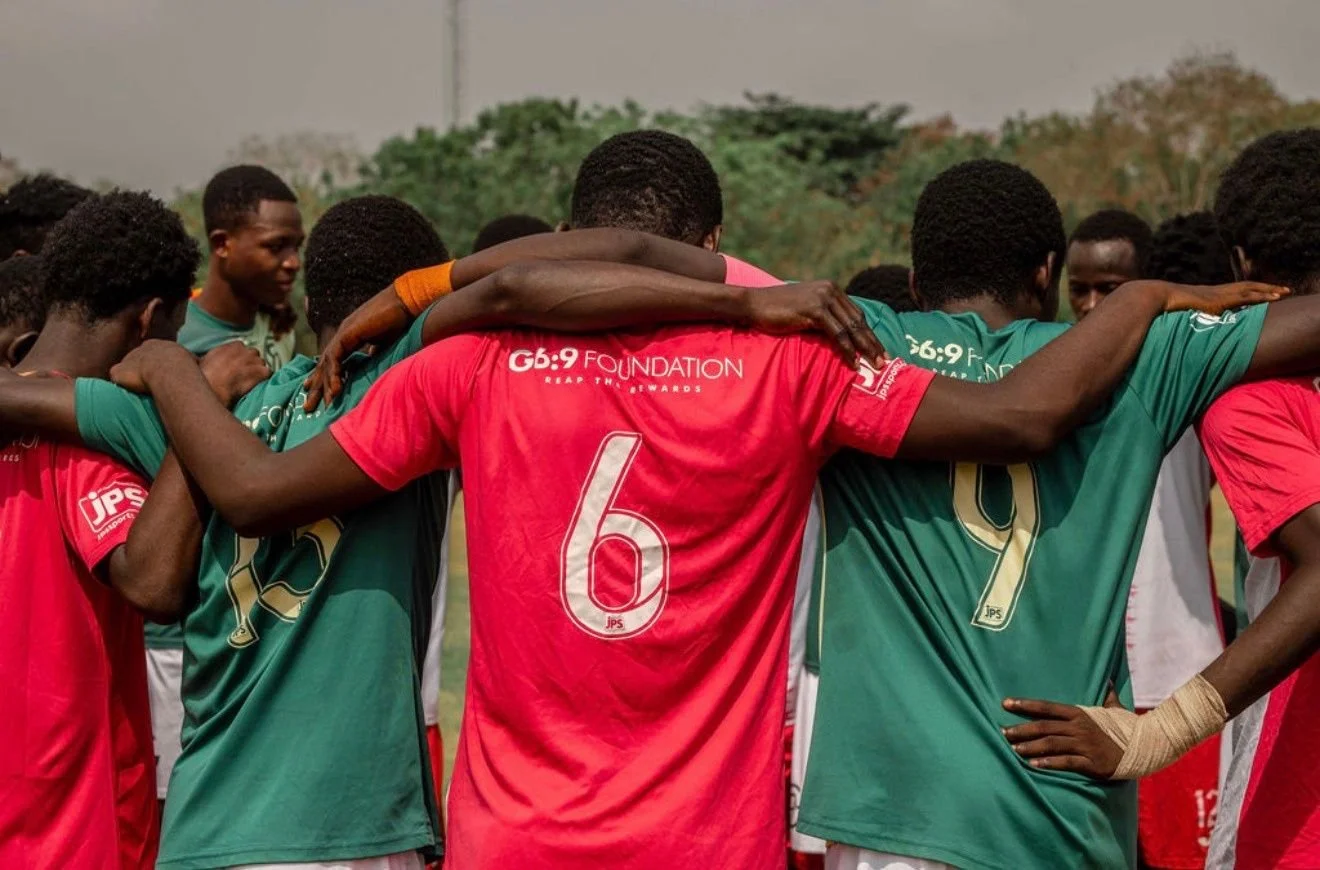 G6:9 Foundation players in a team huddle
