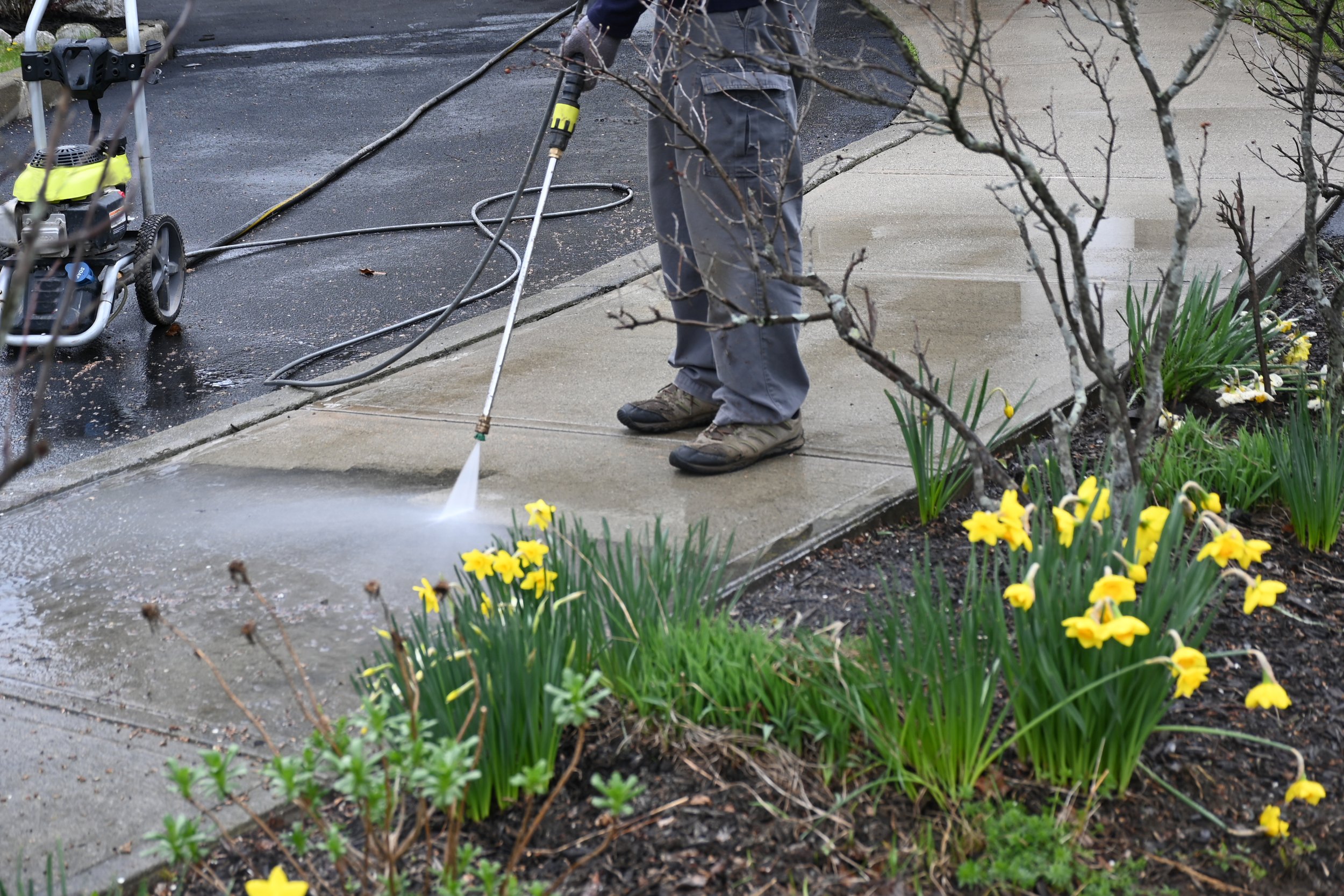 man-washing-off-dirt-men-uses-power-washer-spring-cleaning.jpg