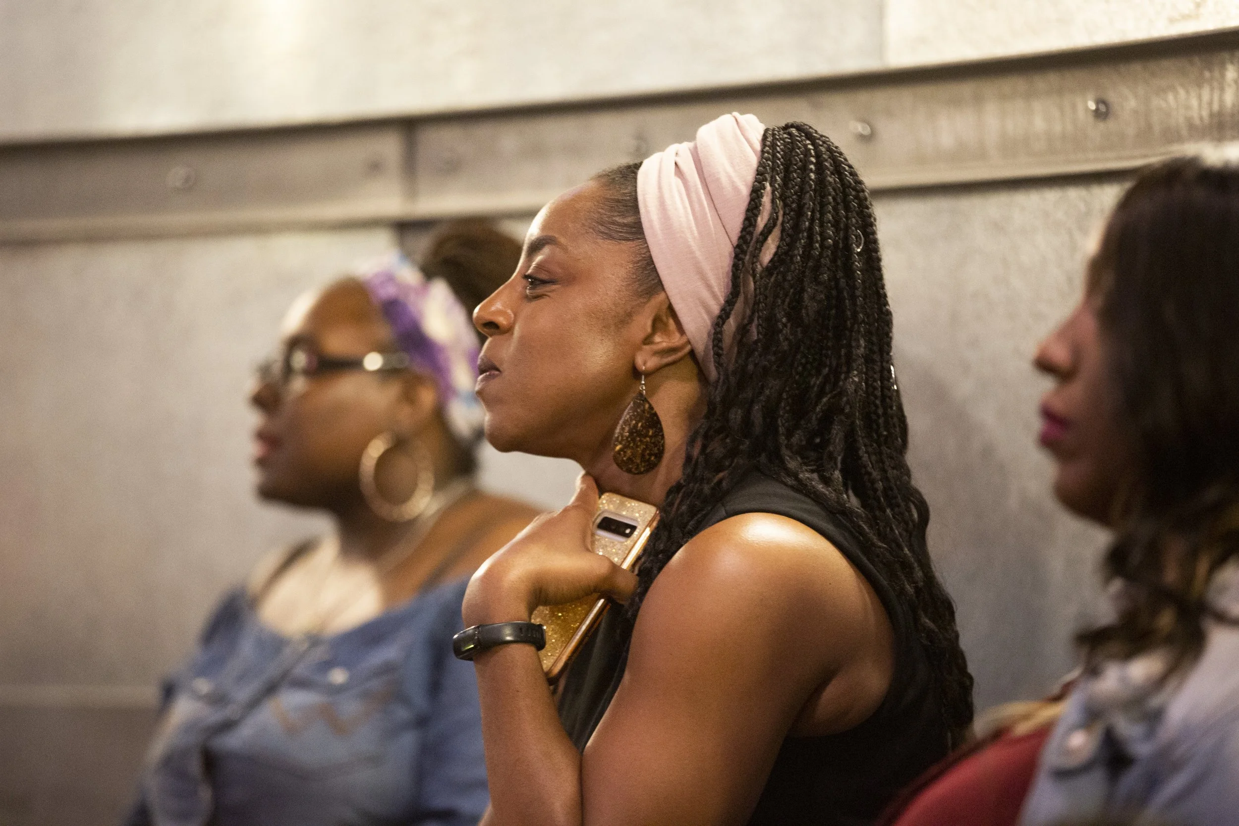 Guests listening to presenters.