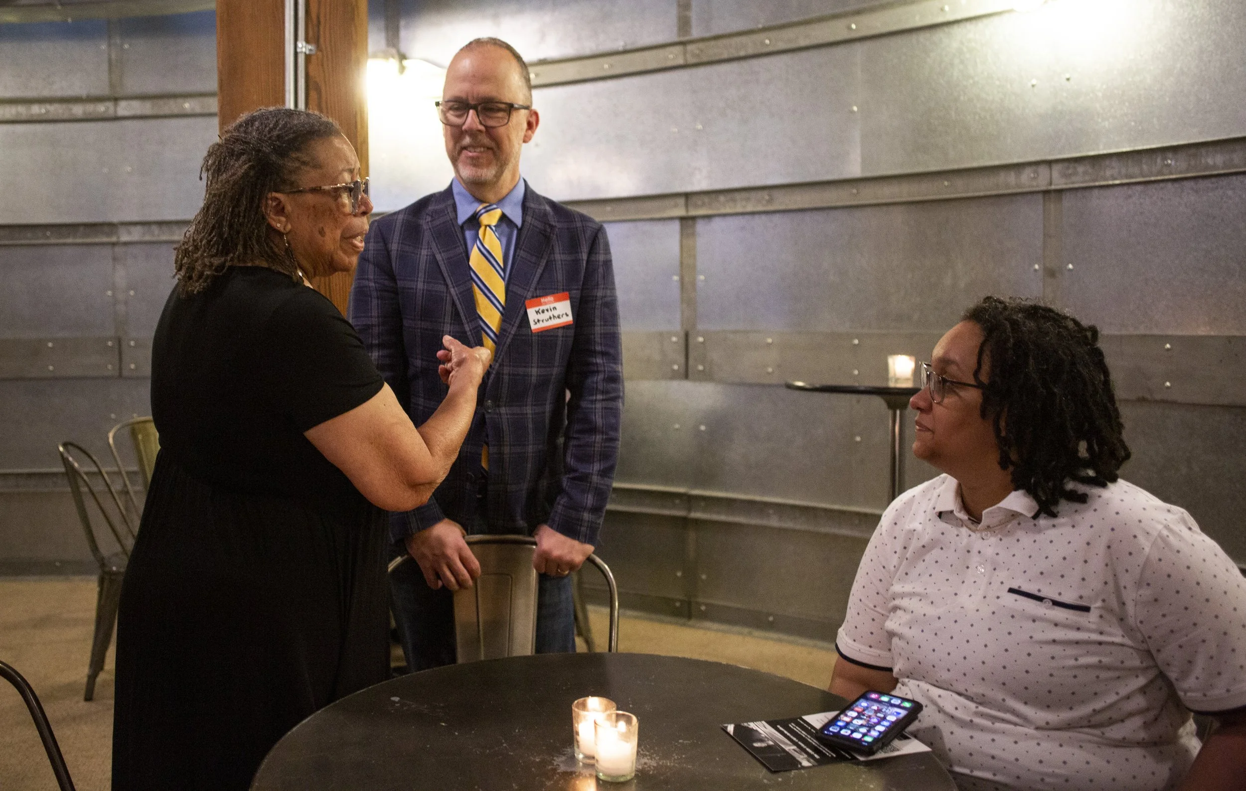 Bobbie, Megan and Kevin chatting.