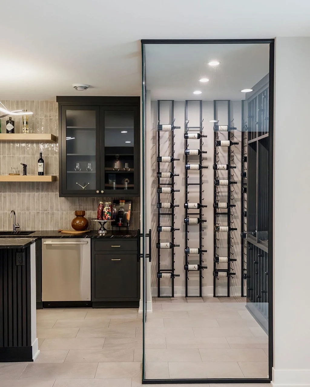 Cheers to late-night pours and effortless hosting! 🍷✨ 

Check out our most recent chic, modern lower level bar with a stunning wine cellar. 

Builder: @bellinconstruction 
Designer: @mollyhowedesign 
Photos: @architectural_imaging 

#CustomHomeBuild