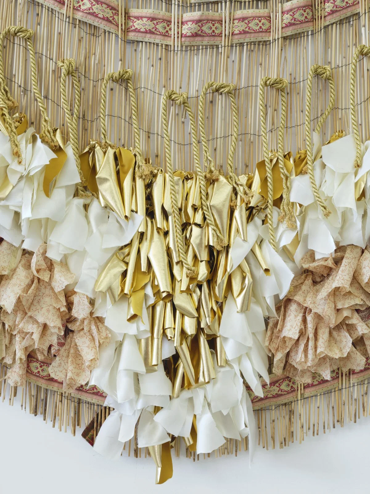 memory falls (Kaieteur Falls), 2022, vintage saris, fabric, cord, and reed fence, 60" x 72"