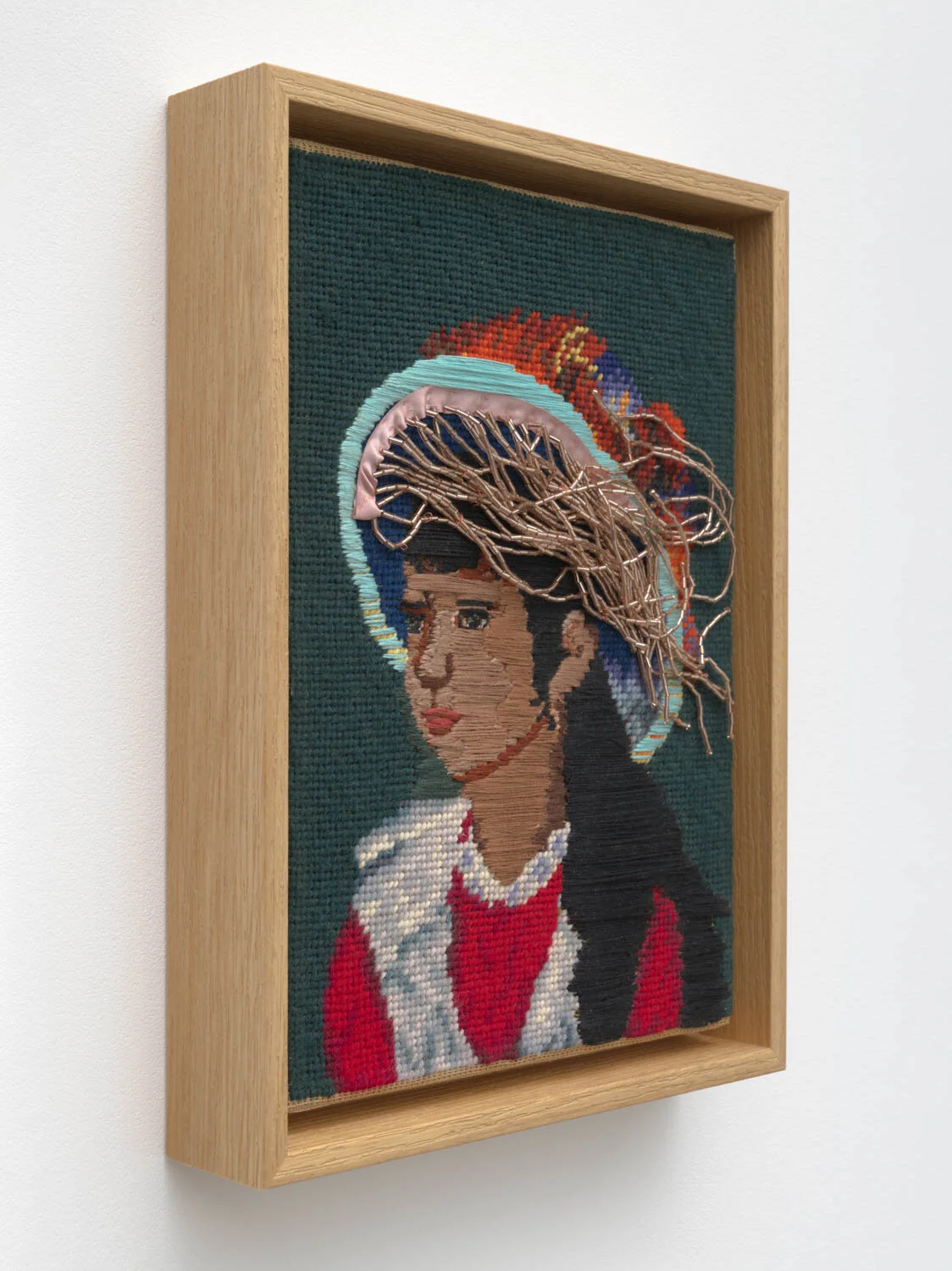 either side of time, 2023, embroidery floss and beaded trim on found needlepoint, 12" x 9"